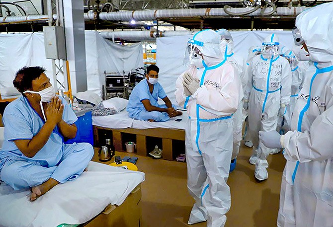 Union minister for health and family welfare, science and technology and earth sciences, Dr. Harsh Vardhan, visits the 10,200-bedded Sardar Patel COVID Care Centre developed at Radha Soami Satsang Beas, in Chhattarpur, New Delhi. Photograph: PTI Photo